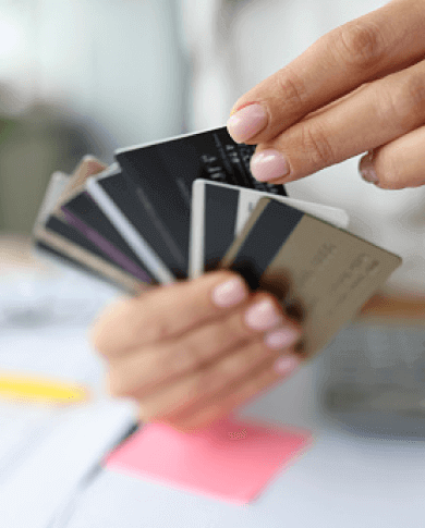 Person holding credit cards